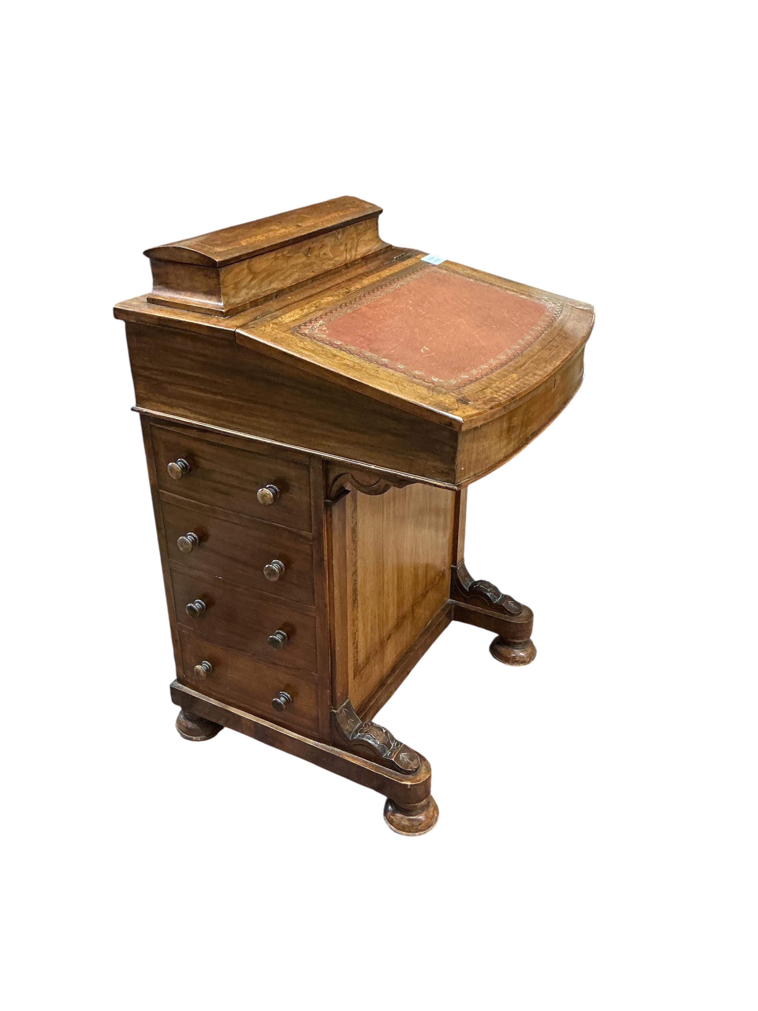 A late Victorian banded walnut Davenport, width 53cm, depth 54cm, height 84cm